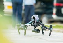 gray-and-green-quadcopter-drone-on-ground-744366 gray-and-green-quadcopter-drone-on-ground-744366